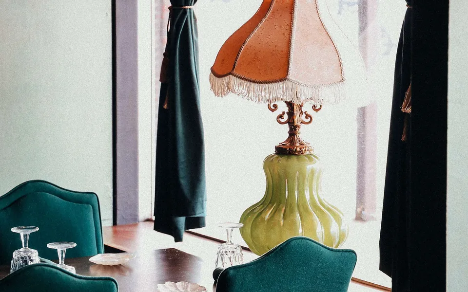 An intimate dining table set beside the window